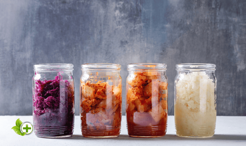 4 fermented foods in jars in a post about Gut Health Hacks